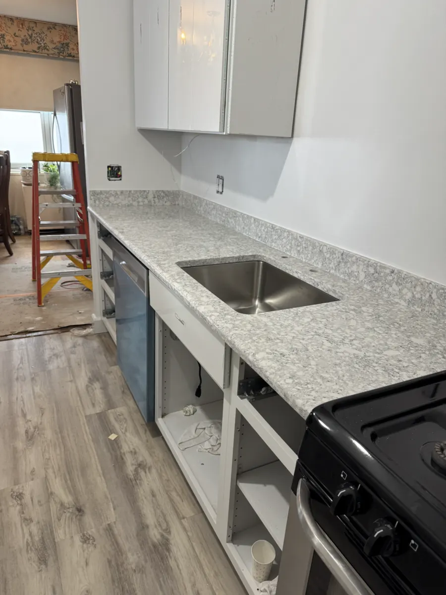 Base cabinets, countertop, and sink area before the cabinet fronts were installed in the Glen Ridge kitchen